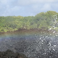 Faint rainbow from crashing waves at Waiʻanapanapa State Park